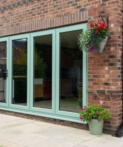 green easifold doors on brick house